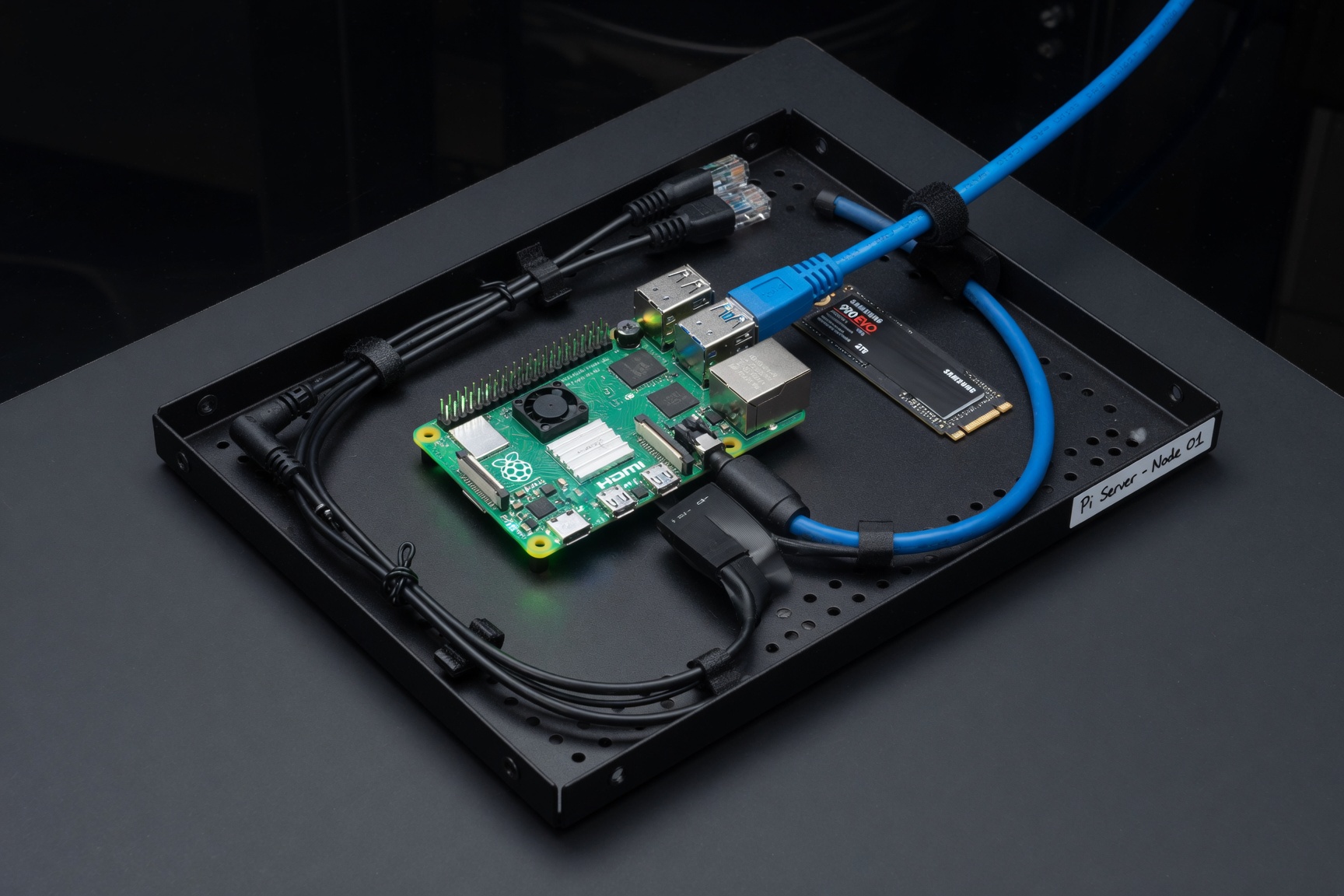 Raspberry Pi bitcoin node setup with SSD, cables, and monitor